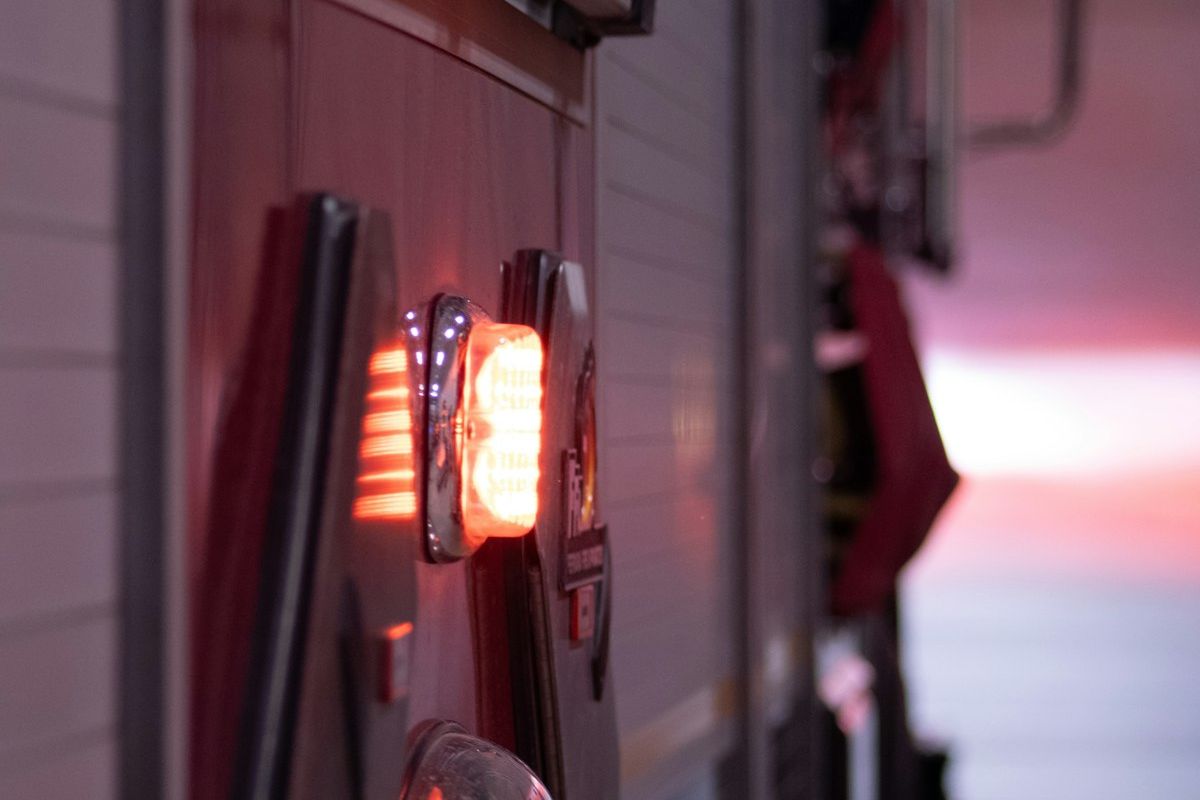Close-up of fire apparatus warning lights in a station bay